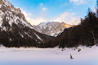 Scenic view of snowcapped mountains against sky during winter