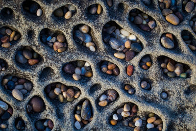Directly above shot of pebbles in rocky holes