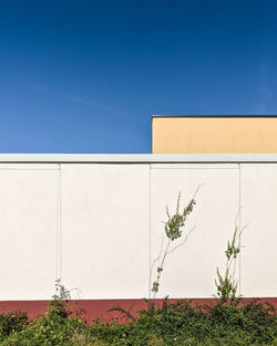 Low angle view of building against clear blue sky