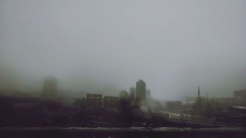 View of cityscape during foggy weather