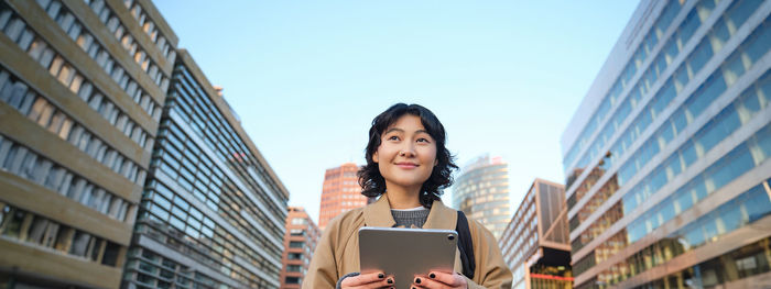 Young woman using mobile phone