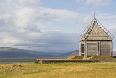 Old abandoned church and lake landscape in paravani lake, georgia