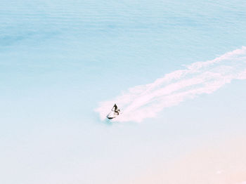 High angle view of person paragliding against sky