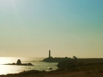 Scenic view of sea against clear sky during sunset