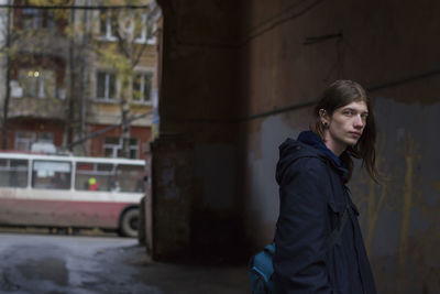 Young man standing in underpass