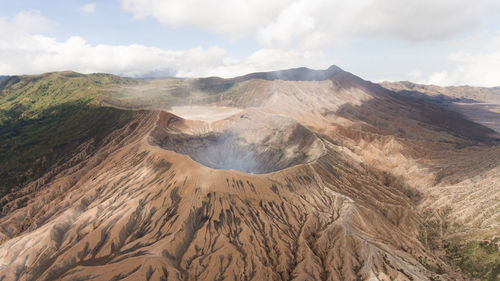 Panoramic view of volcanic landscape against sky