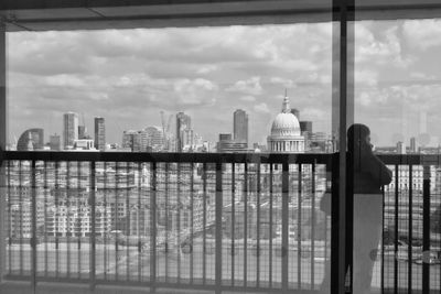 Woman looking through window