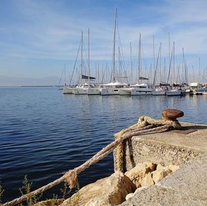 Boats in sea against sky