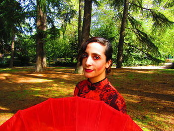 Portrait of young woman in forest