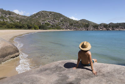 Full length of man on beach against sky