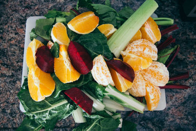 High angle view of fruits and vegetables in tray on table