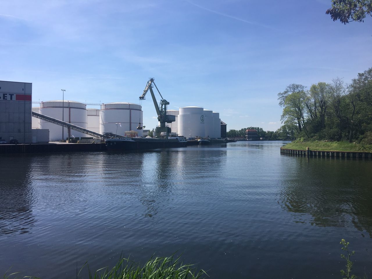 industry, factory, sky, freight transportation, shipping, water, no people, waterfront, outdoors, built structure, day, smoke stack, technology, cargo container, nautical vessel, nature