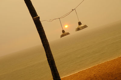 Scenic view of beach against sky during sunset