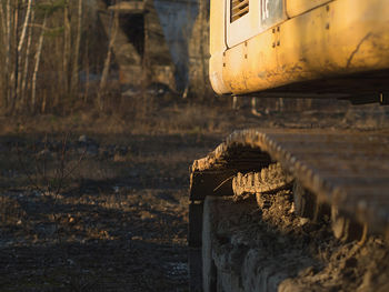 Old rusty excavator on land