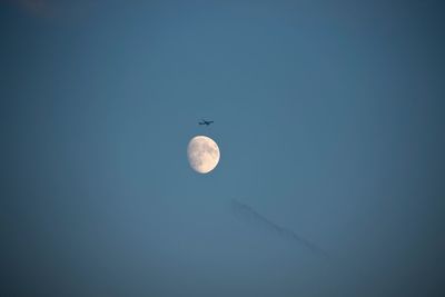 Scenic view of moon against clear sky at night