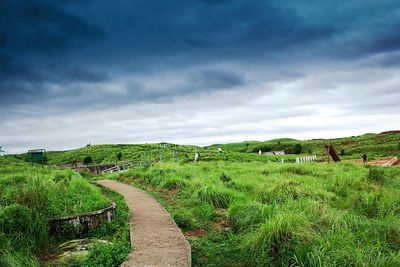 Scenic view of farm against sky