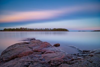 Scenic view of lake against sky during sunset