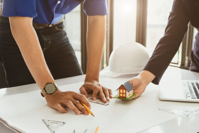 Low angle view of people working on table