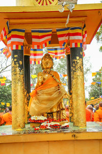 Statue outside temple against building