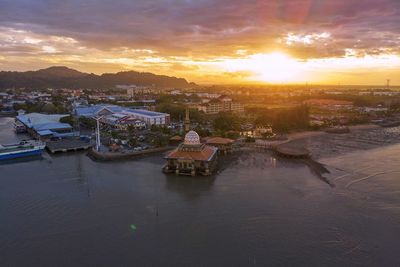 Scenic view of buildings against sky during sunset