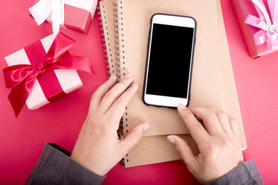 Close-up of hand using mobile phone