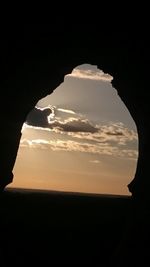 Silhouette landscape against sky during sunset