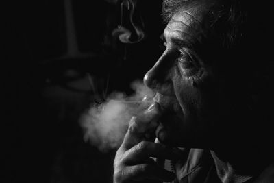 Close-up of man smoking