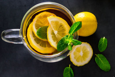 High angle view of fruits and drink on table