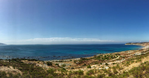 Scenic view of sea against blue sky