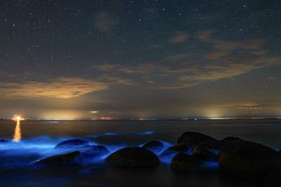 Scenic view of sea against sky at night