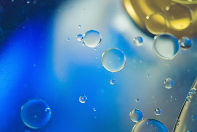 Close-up of bubbles against sea