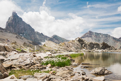 Scenic view of lake and mountains against sky