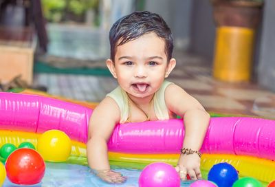 Portrait of cute girl playing with toy