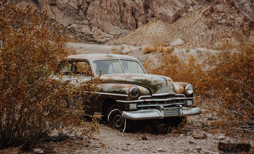 Abandoned car on field