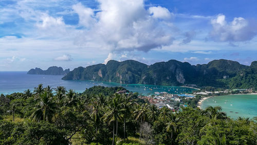 Panoramic view of sea and trees against sky