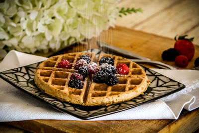 Strawberries in plate on table