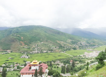 Scenic view of landscape and mountains against sky