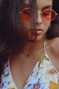 Close-up of young woman wearing sunglasses