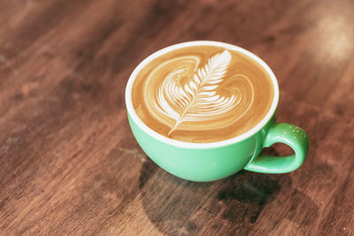 High angle view of cappuccino on table