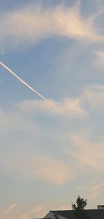 Low angle view of vapor trails in sky