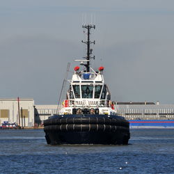 Ship in sea against sky