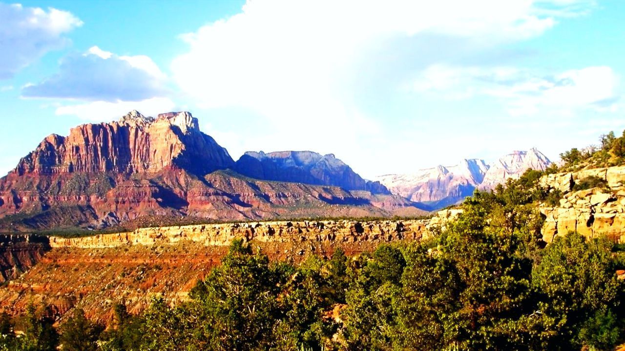 SCENIC VIEW OF MOUNTAINS AND SKY