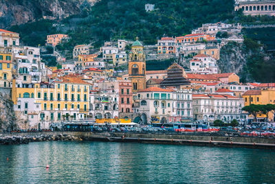 Aerial view of townscape by sea