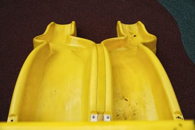 High angle view of yellow slide on playground