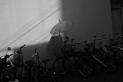 Bicycles parked against wall