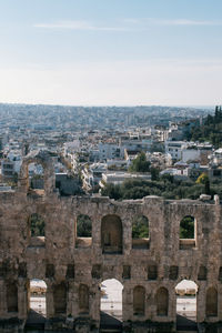 Acropolis against sky during sunny day