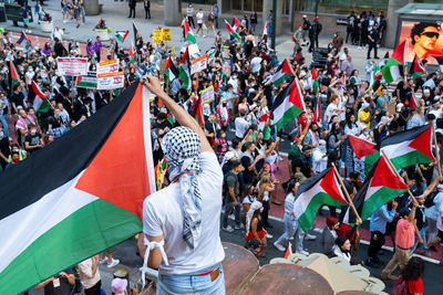 Palestinian flag held over a palestinian protest - day of rage. photographed june 15, 2021 
