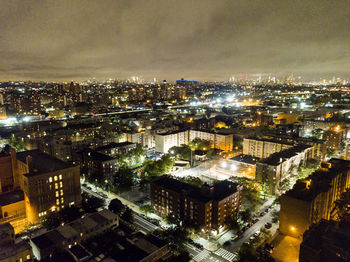 High angle view of illuminated cityscape at night