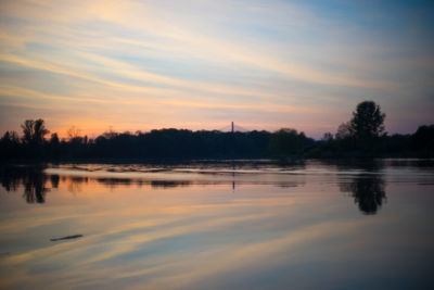 Scenic view of lake against sky during sunset