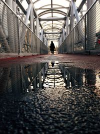 Man walking on bridge